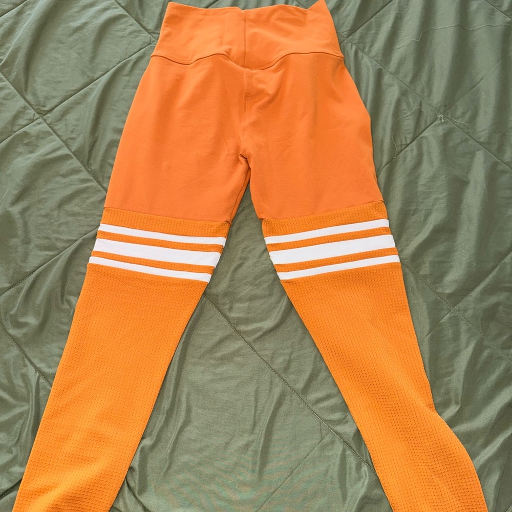Bombshell Sportswear Orange and White Leggings with Striking Stripes